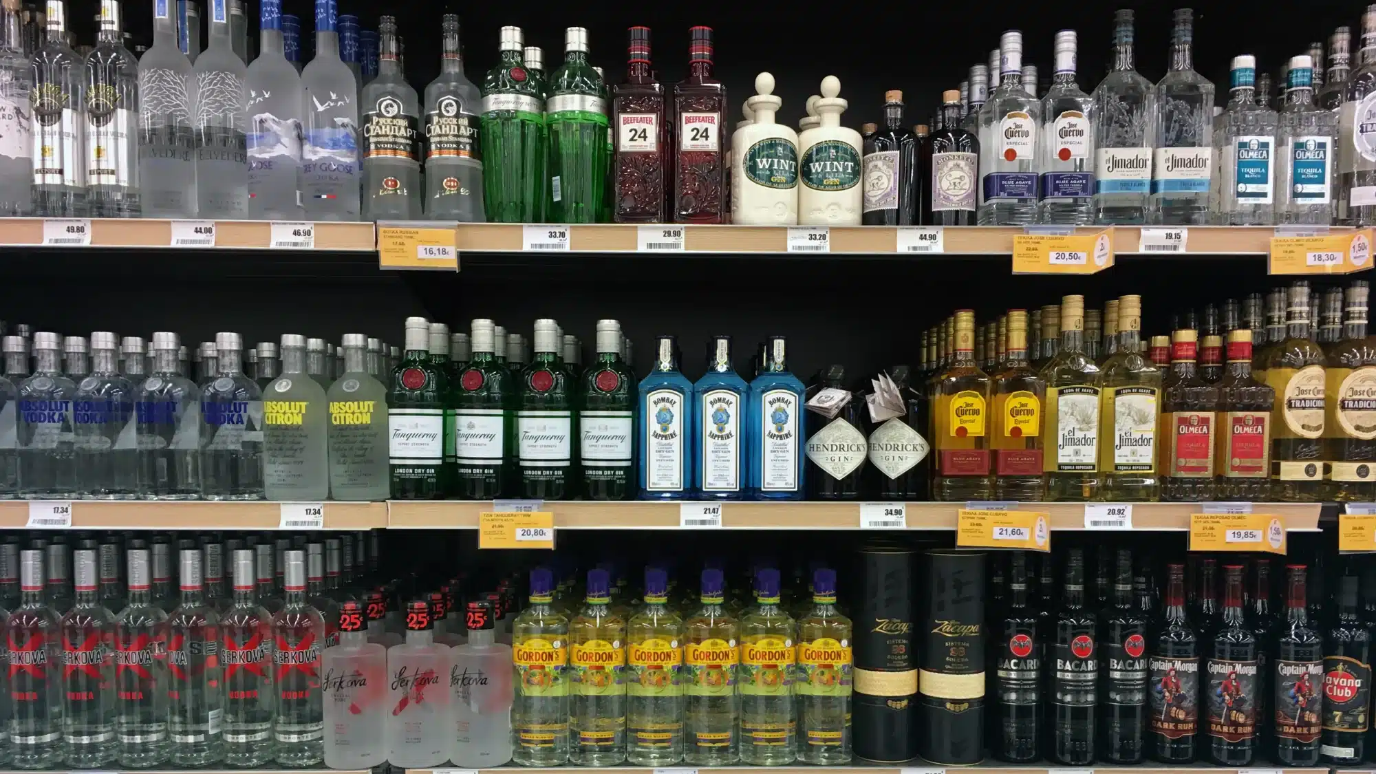 customers shopping for wine and whiskey
