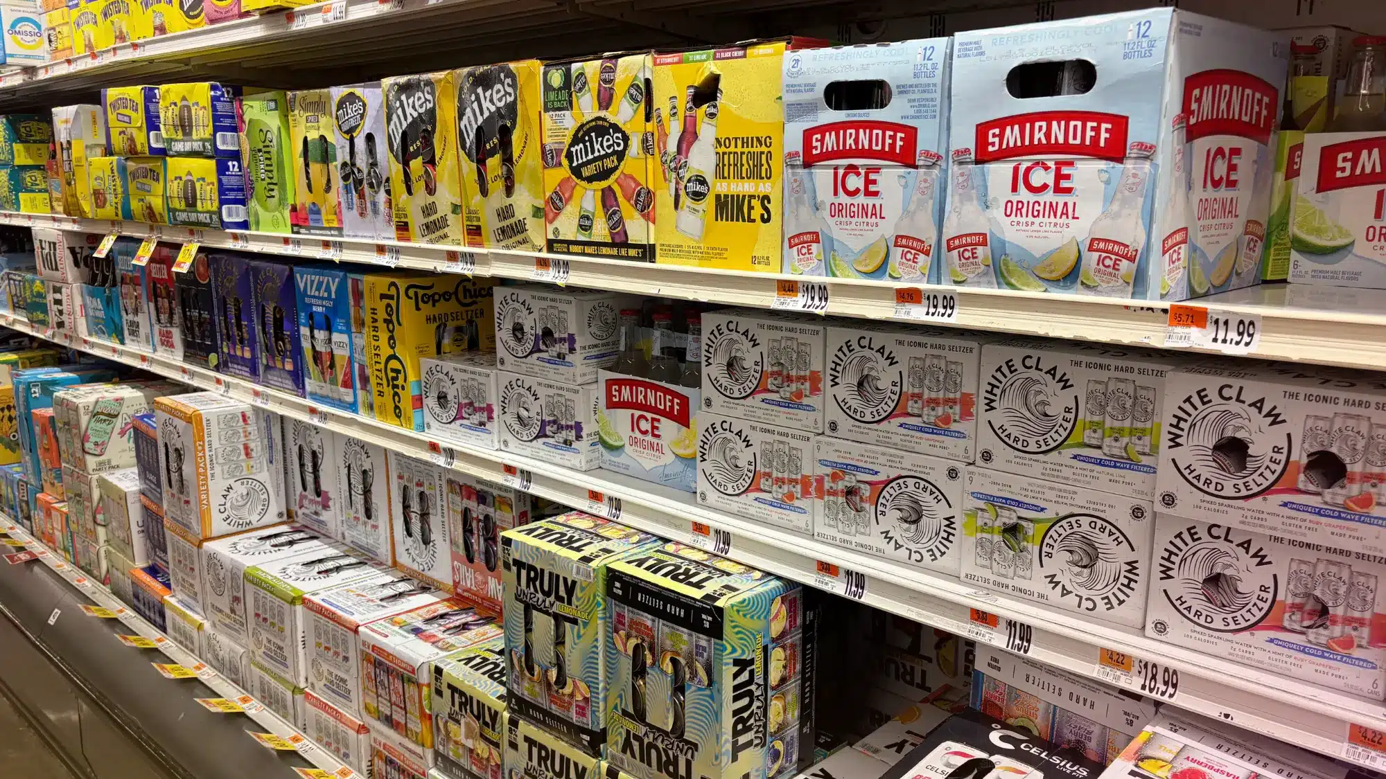 Hard seltzer variety packs including White Claw, High Noon, and other flavored sparkling alcoholic beverages available at liquor stores and retail shops in Connecticut