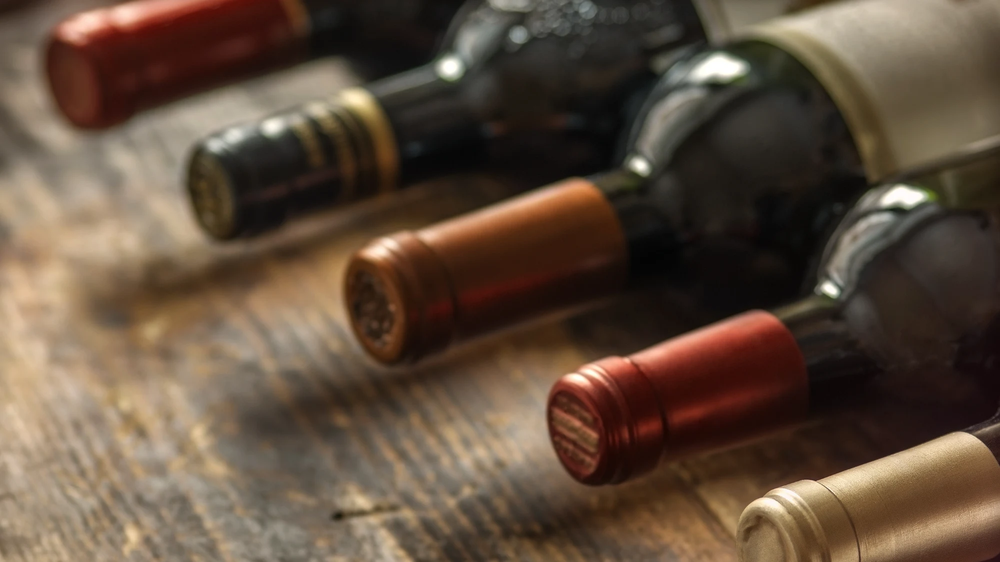 shop-your-favorite-wines-online-through-reliable-wine-stores-serving-groton-ct A person conveniently browsing a selection of fine wines online on a tablet at home.